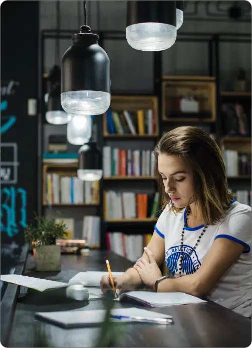 Author writing at desk